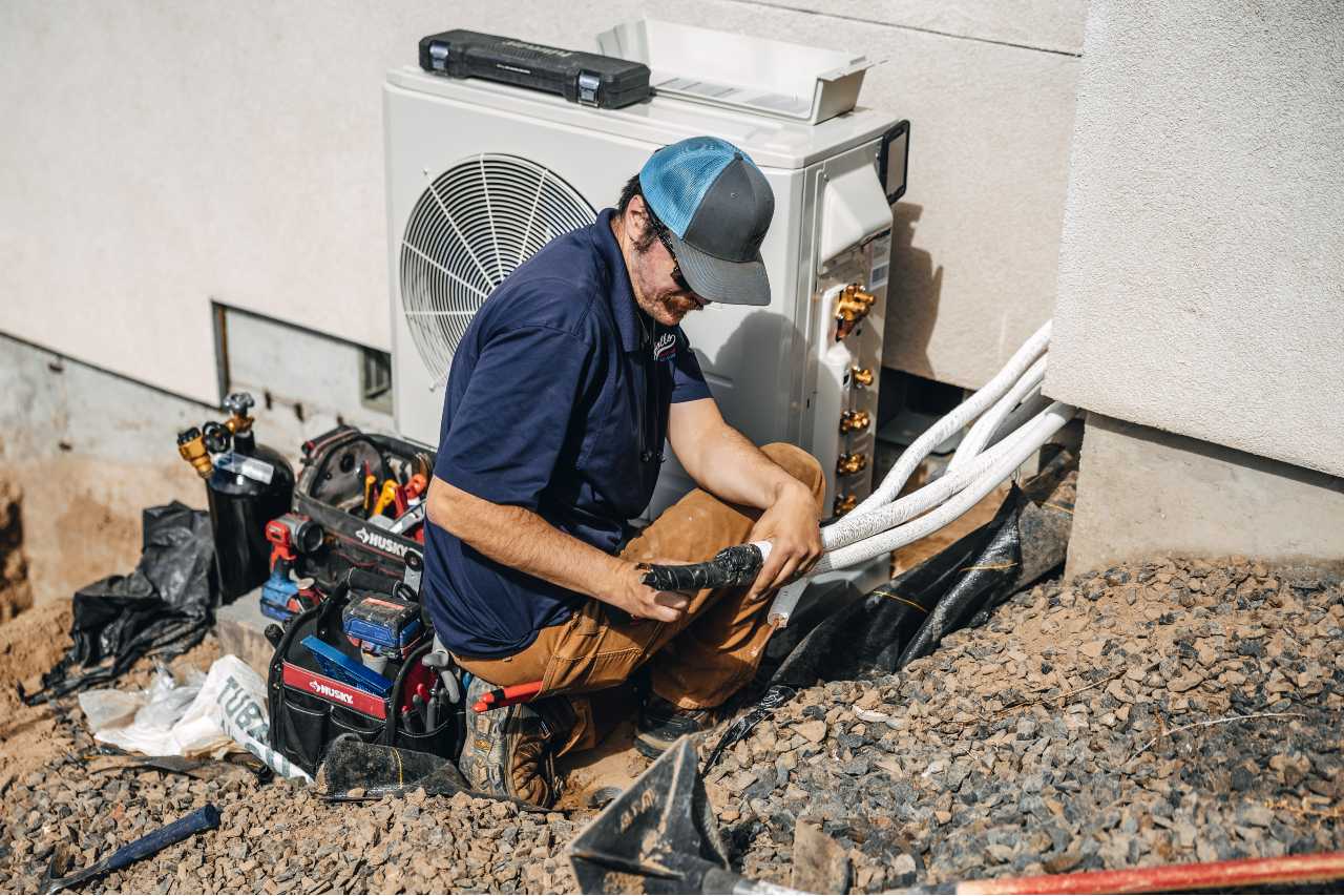 techinician doing a ductwork inspection Apollo Heating and Air