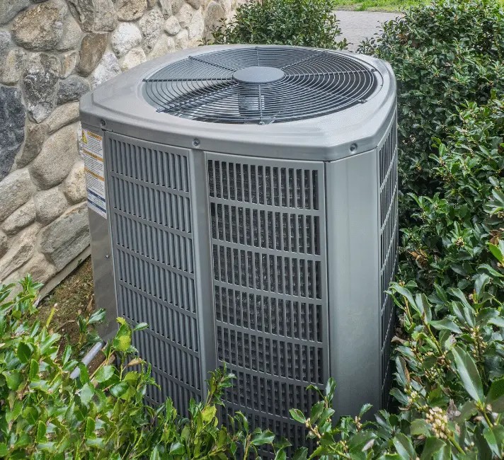 air conditioner installed outside Apollo Heating & Air