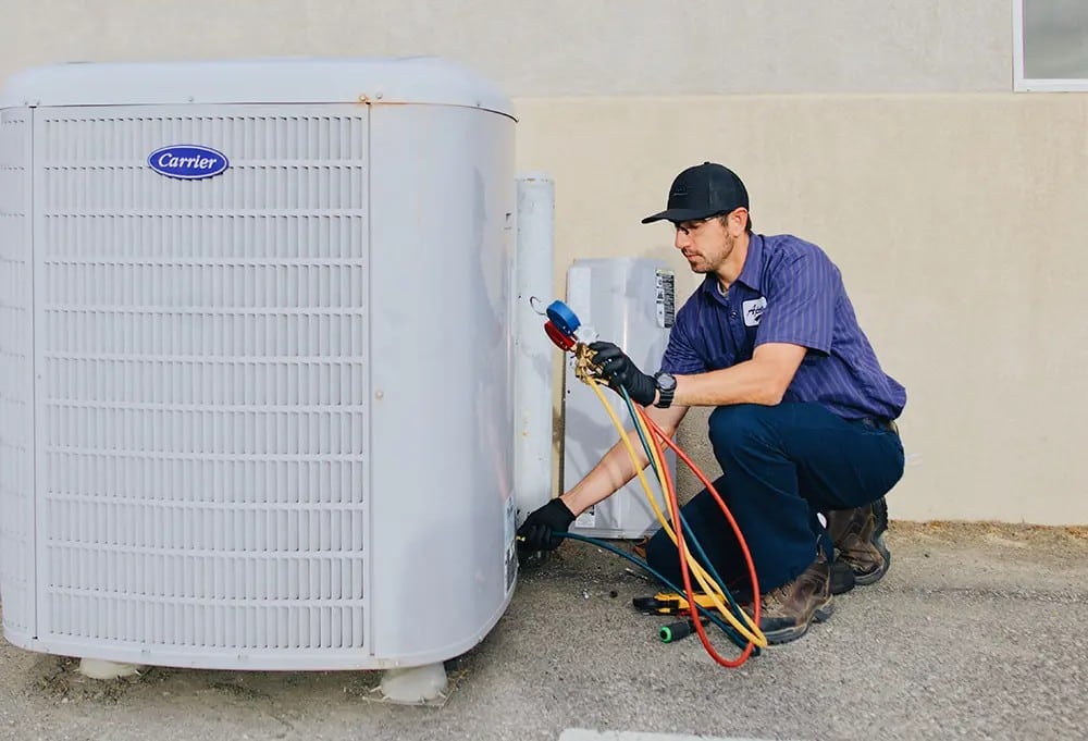 commercial HVAC service technician at work Apollo Heating & Air