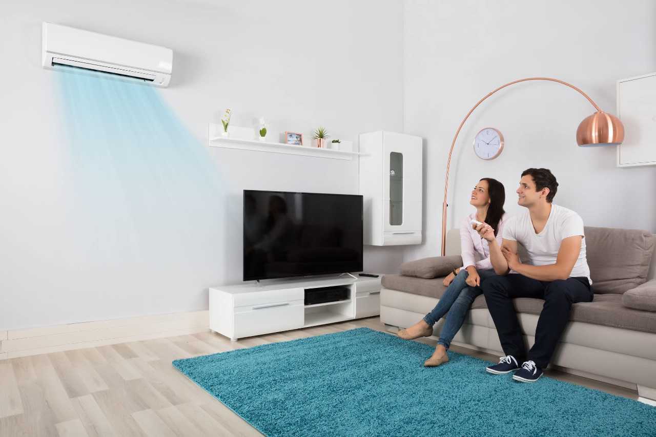 couple enjoying a centralized living room Apollo Heating and Air