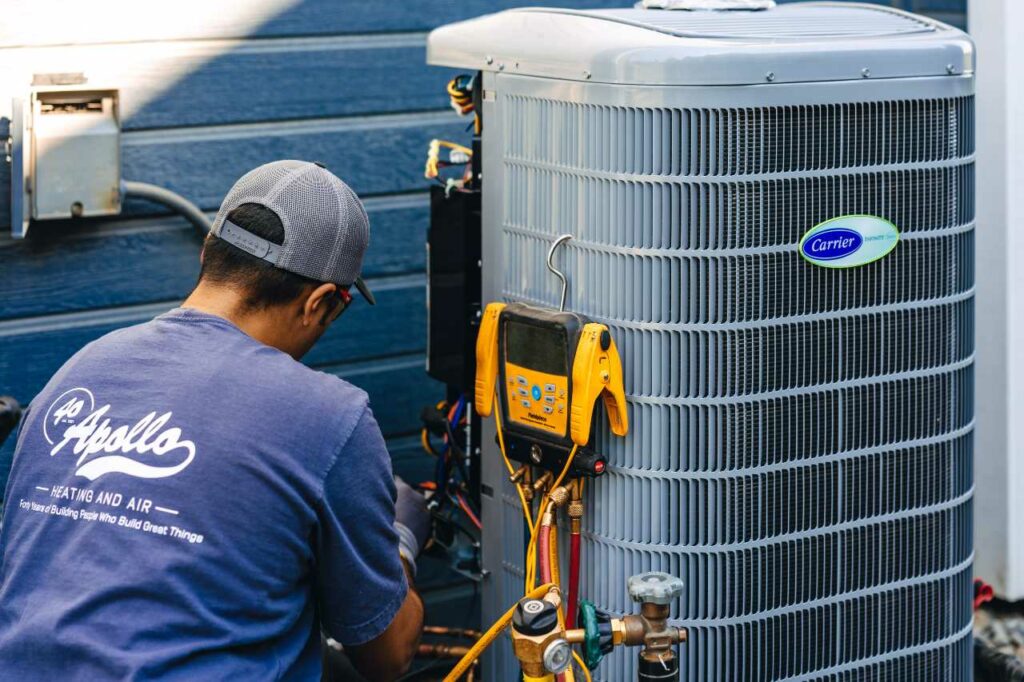 professional technician installing your hvac system Apollo Heating & Air