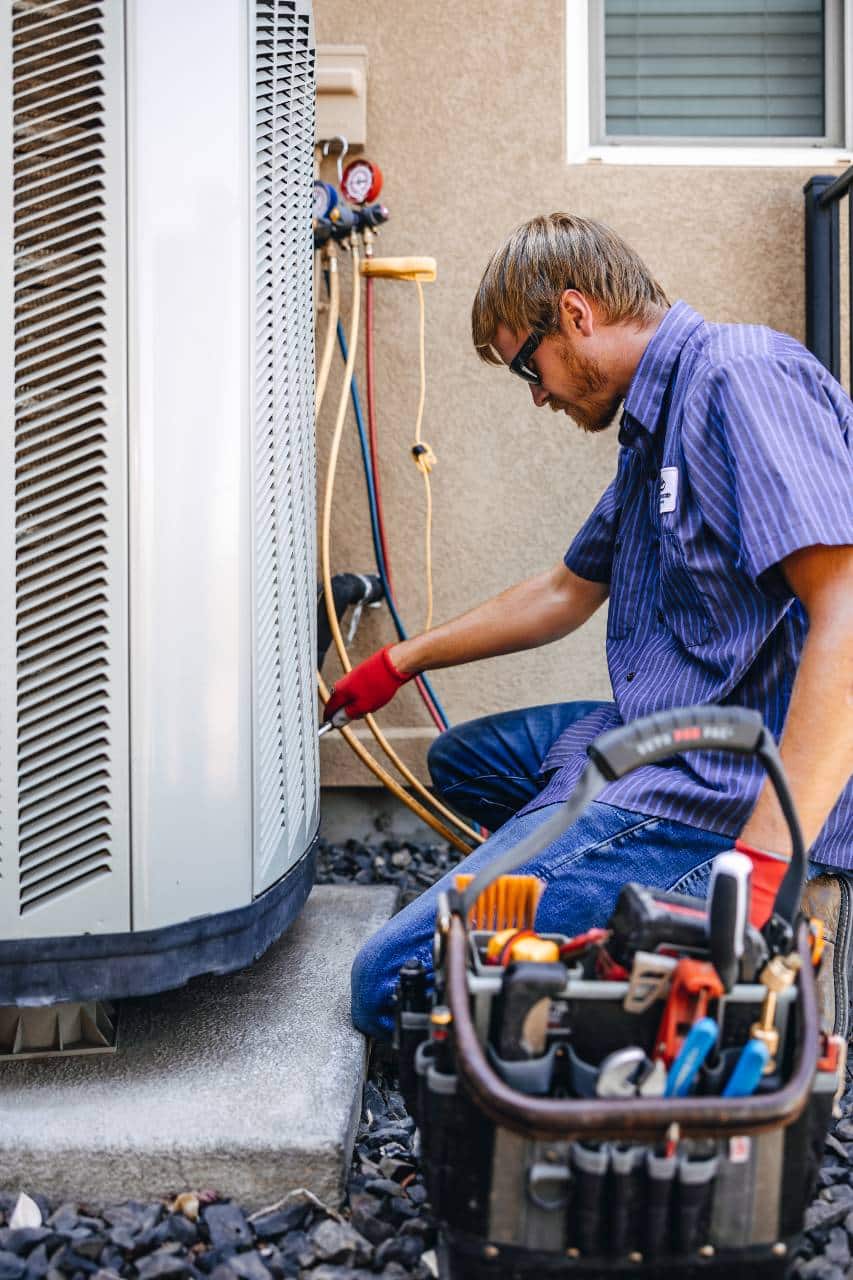 Apollo Heating & Air staff checking HVAC system